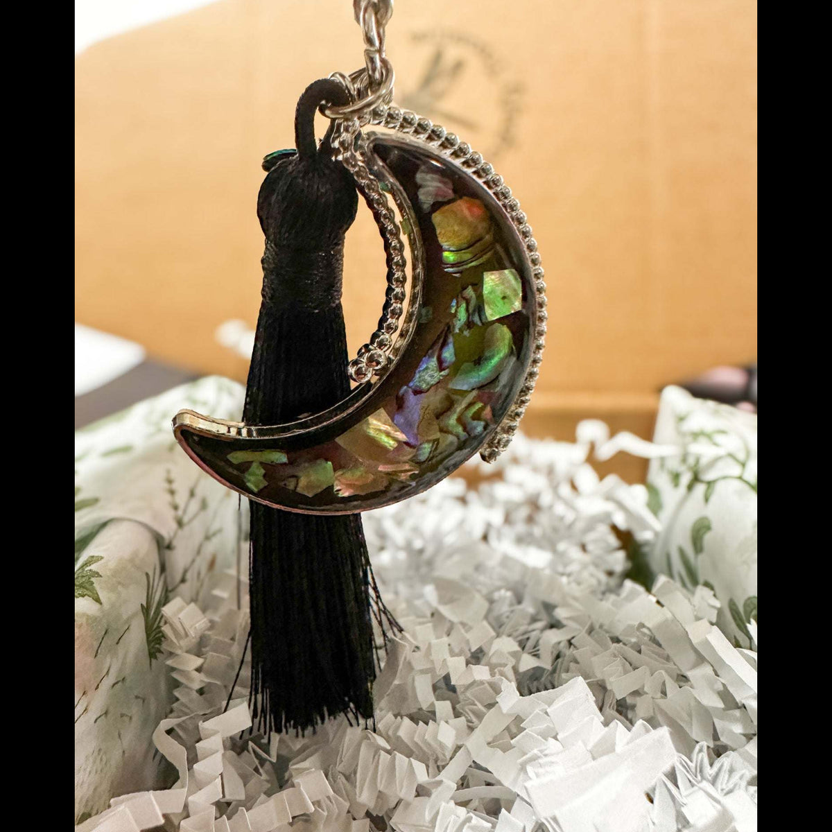 Northern Lights Keychain in an ornate silver frame, shell mosaic moon in a gift box with a black tassel