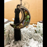 Northern Lights Keychain in an ornate silver frame, shell mosaic moon in a gift box with a black tassel