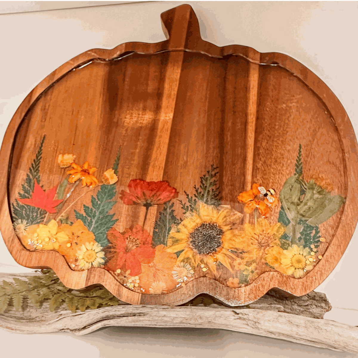 Wooden harvest pumpkin tray with real pressed sunflower, dried botanicals, bee charm, and gold glitter decoration