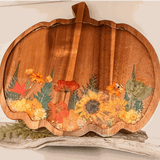 Wooden harvest pumpkin tray with real pressed sunflower, dried botanicals, bee charm, and gold glitter decoration