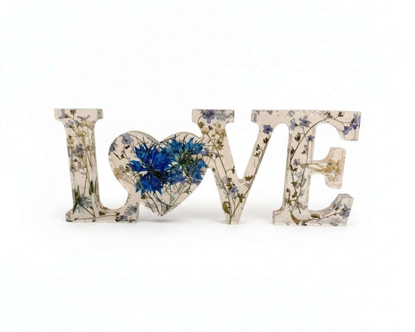 forget me not resin love sign in clear resin with blue pressed flowers, delicate greenery and silver leaf LOVE lettering