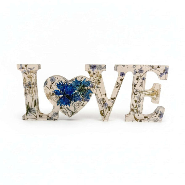 forget me not resin love sign in clear resin with blue pressed flowers, delicate greenery and silver leaf LOVE lettering