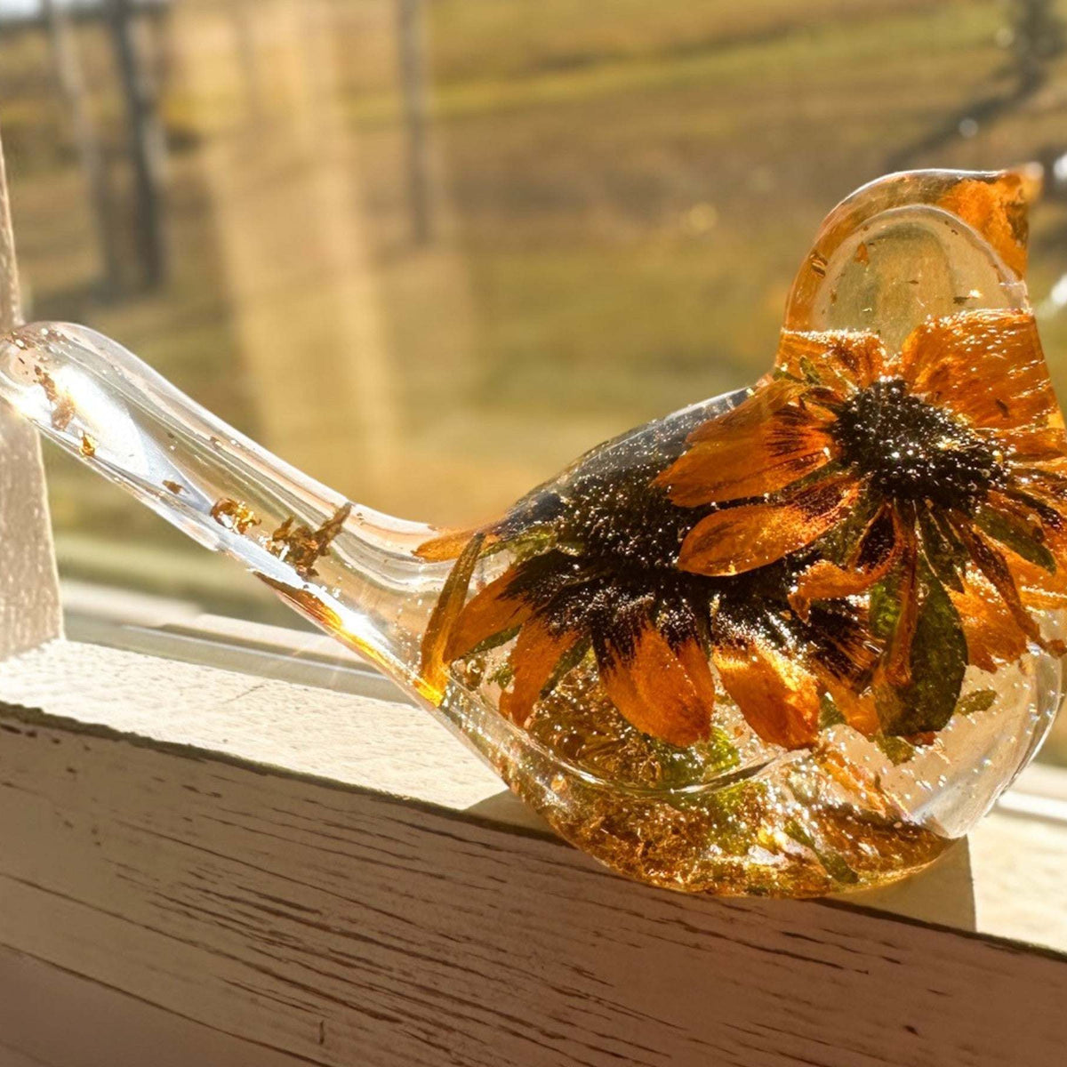 Black eyed susan bird figurine with two real two-tone blooms and gold leaf in clear resin