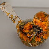 Black eyed susan bird figurine with two real two-tone blooms and gold leaf in clear resin