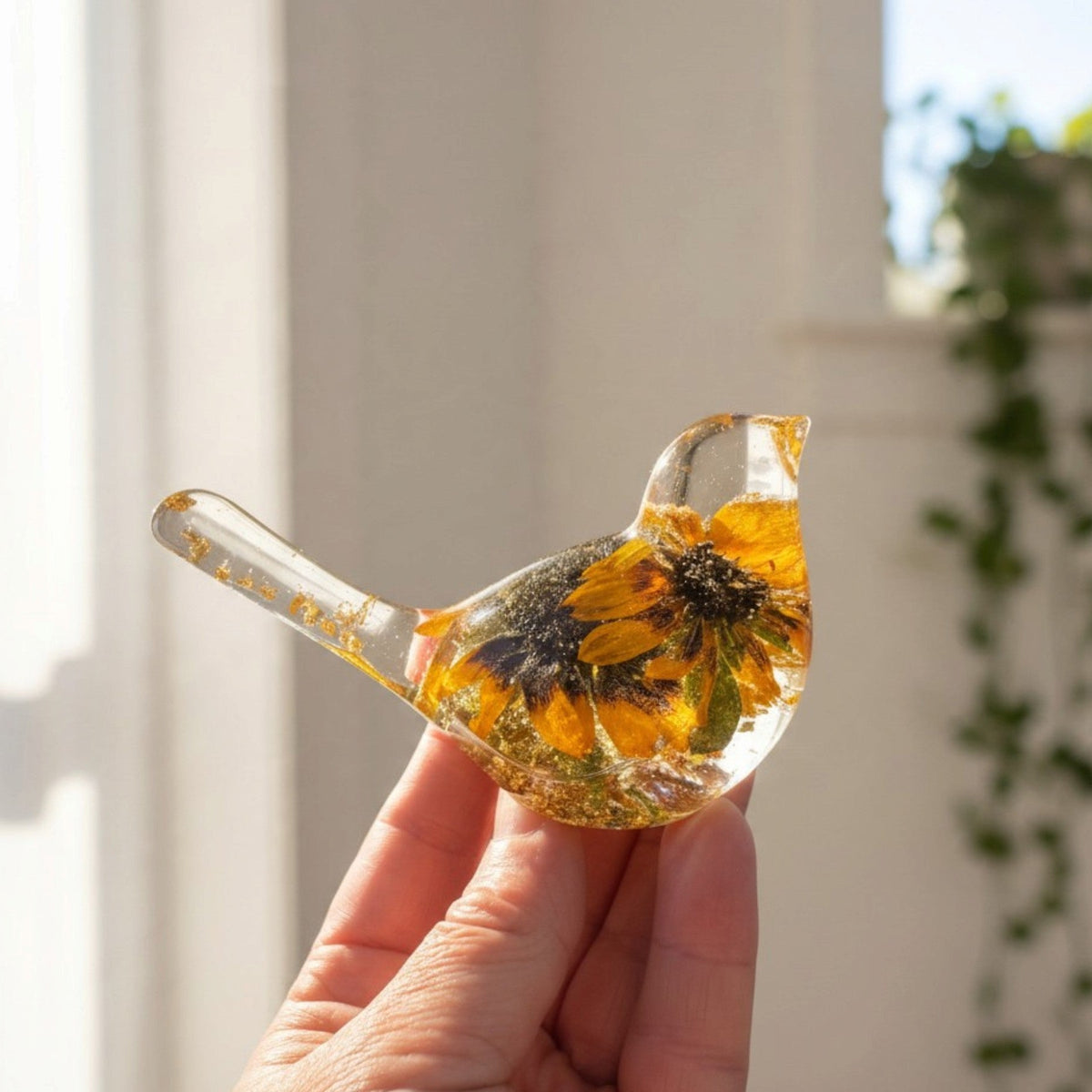 Black eyed susan bird figurine with two real two-tone blooms and gold leaf in clear resin