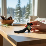 Close-up of handmade owl bag charm showing Northern Lights resin cabochon with pressed ferns