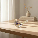 Blue Lupine resin bird decor, clear resin songbird with deep blue and yellow blooms and green botanicals in its tail