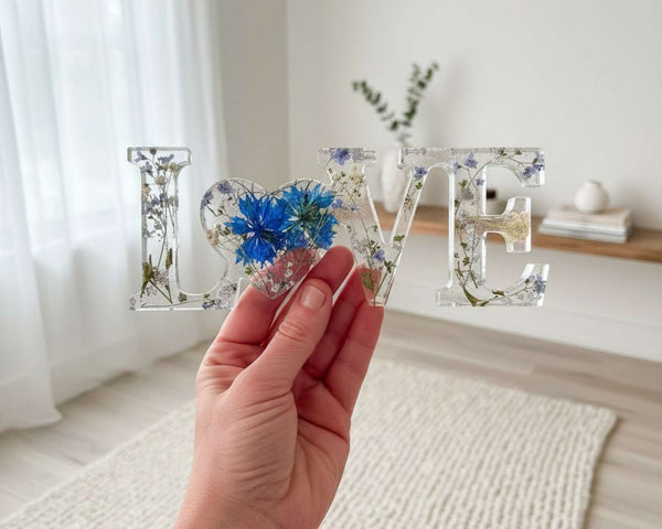 Forget me not resin love sign in clear resin with pressed blue flowers, baby's breath and silver leaf accents
