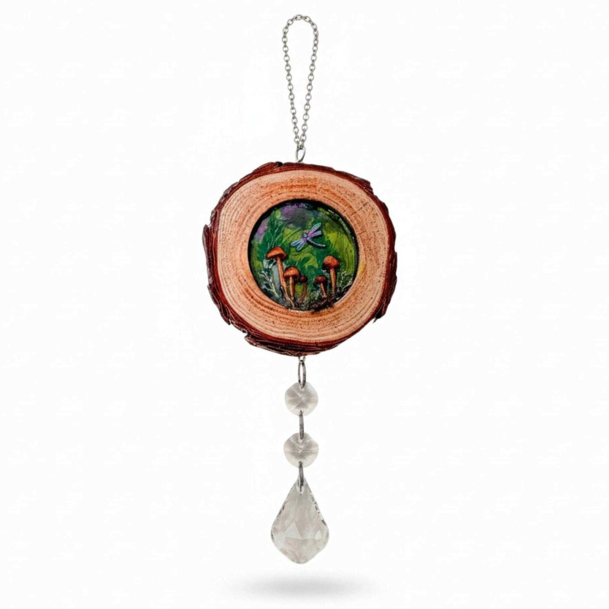boreal forest suncatcher with a bark-edged wood slice, colorful mushroom scene, purple dragonfly and hanging clear crystals