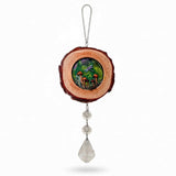 boreal forest suncatcher with a bark-edged wood slice, colorful mushroom scene, purple dragonfly and hanging clear crystals
