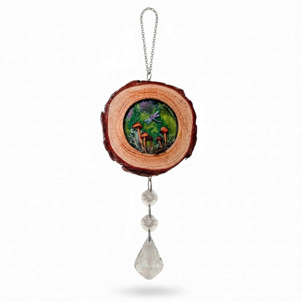 boreal forest suncatcher with a bark-edged wood slice, colorful mushroom scene, purple dragonfly and hanging clear crystals