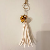 bumble bee resin keychain with an amber honeycomb heart, small bee detail and long cream tassel