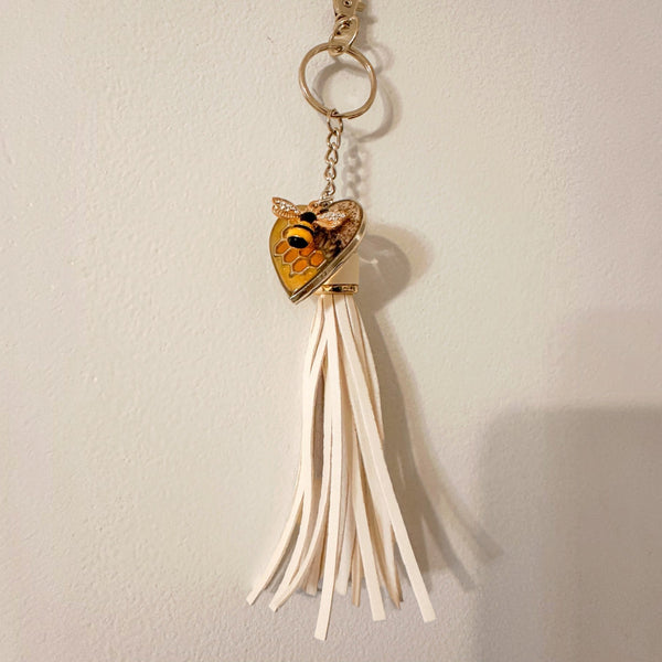 bumble bee resin keychain with an amber honeycomb heart, small bee detail and long cream tassel
