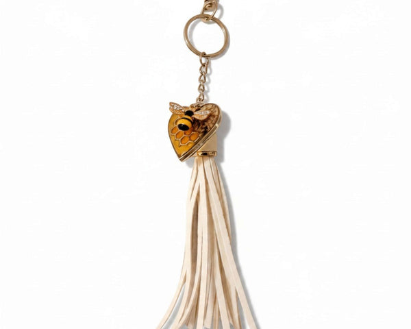 bumble bee resin keychain with a honey-gold heart, bee and honeycomb detail, and long cream tassel