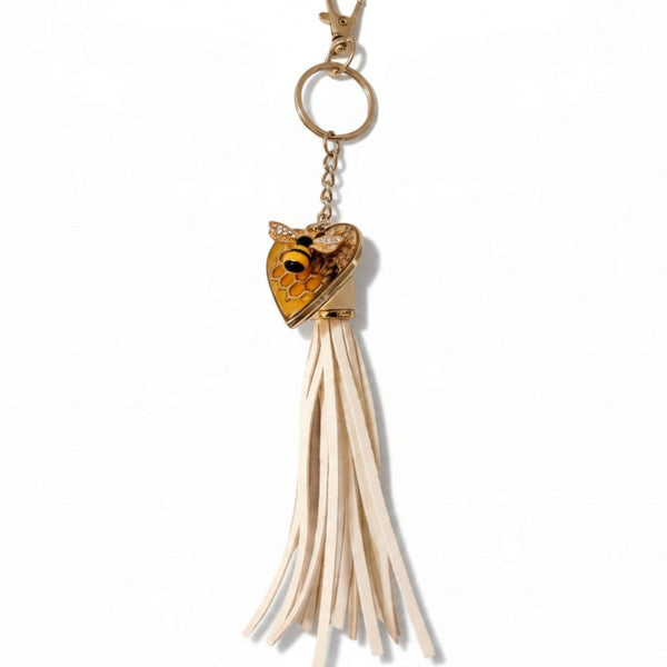 bumble bee resin keychain with a honey-gold heart, bee and honeycomb detail, and long cream tassel