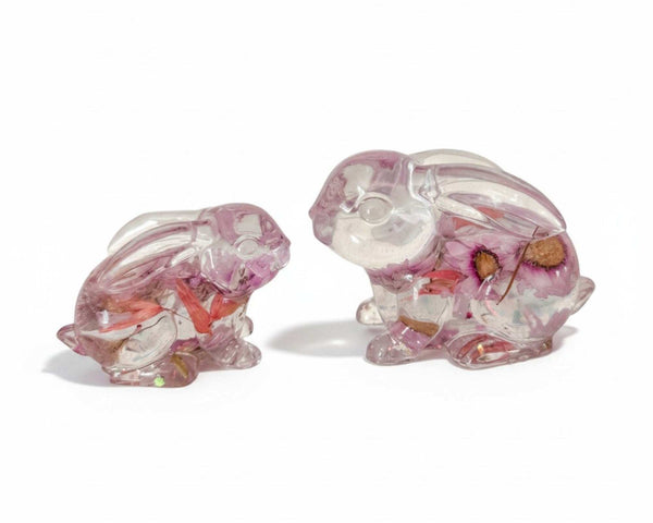 Two pink floral resin bunnies with preserved spring blooms, handcrafted decor pair