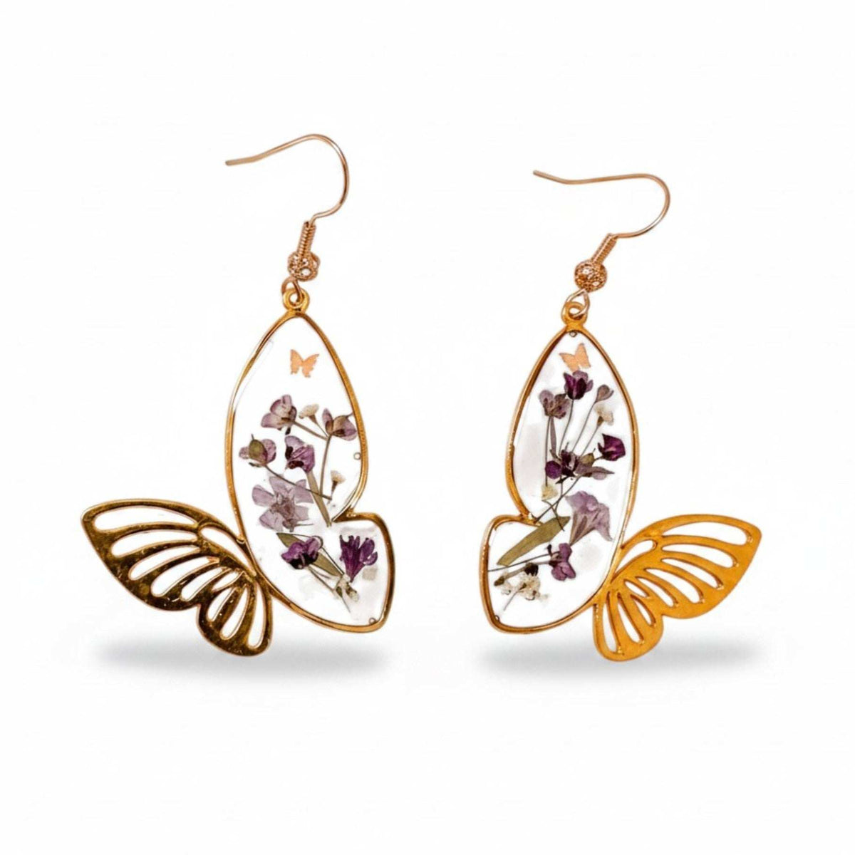 Handmade Fluttering Blossom earrings with real pressed flowers in resin butterfly wings and a delicate butterfly accent