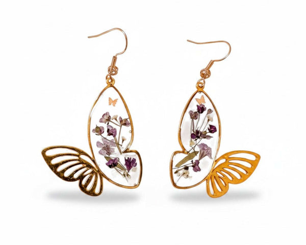 Handmade Fluttering Blossom earrings with real pressed flowers in resin butterfly wings and a delicate butterfly accent