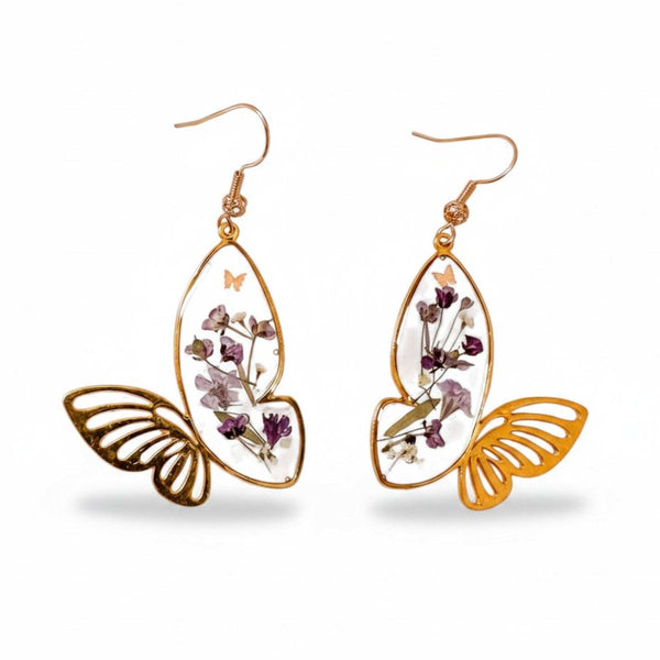 Handmade Fluttering Blossom earrings with real pressed flowers in resin butterfly wings and a delicate butterfly accent