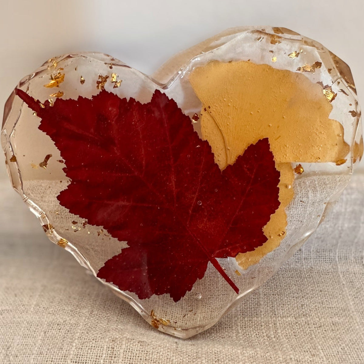 Maple leaf heart resin coaster with a smooth high gloss clear resin finish