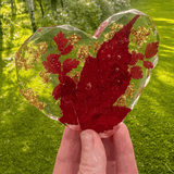 Maple leaf heart resin coaster with a bold red leaf and scattered gold foil