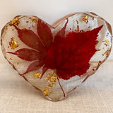 Maple leaf heart resin coaster with gold leaf shimmer through the background
