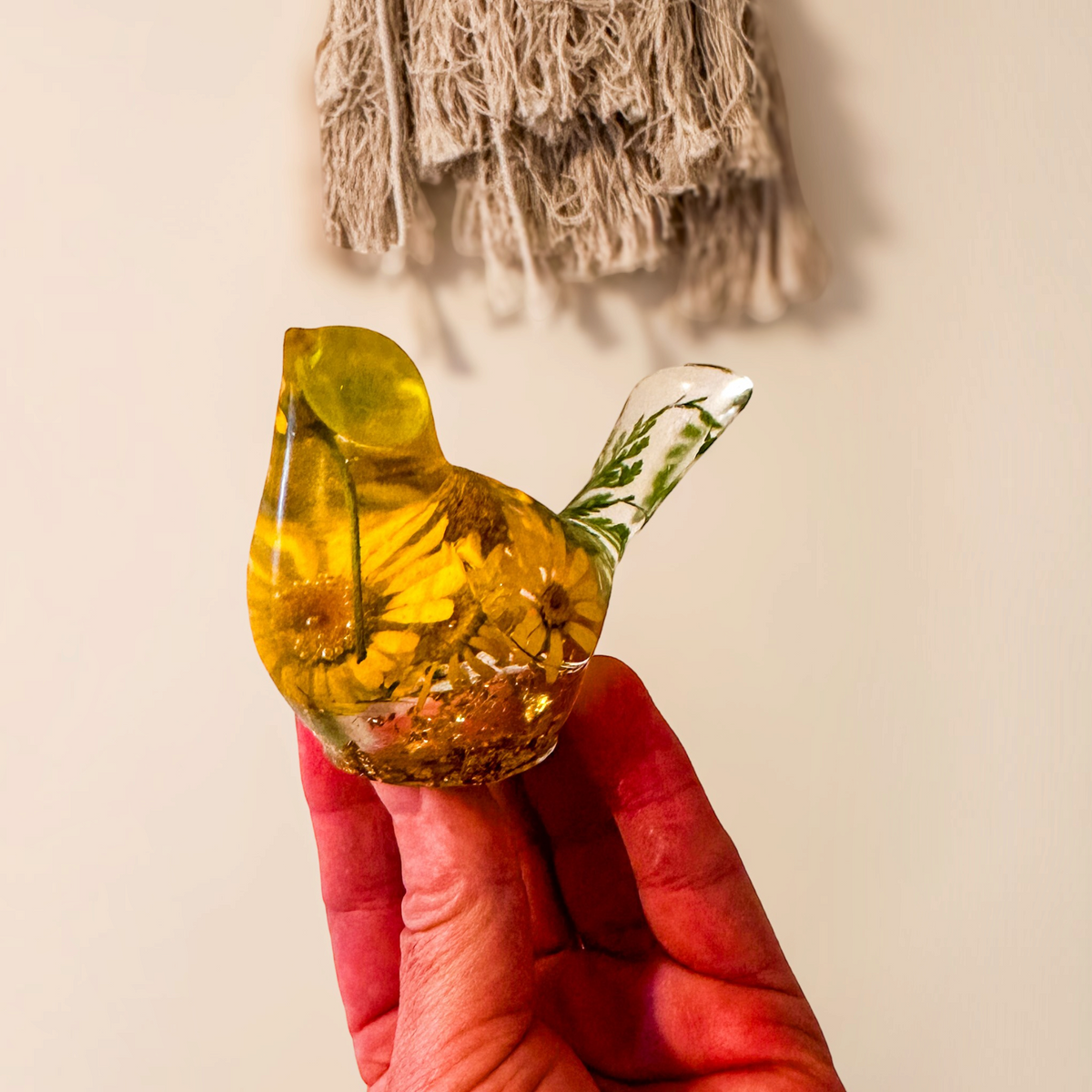yellow canary resin bird with real yellow daisies, green foliage, and gold leaf base, handmade in Alberta