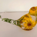 yellow canary resin bird with real yellow daisies, green foliage, and gold leaf base, handmade in Alberta