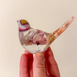 Cherry blossom resin bird with a dried bloom set into the head