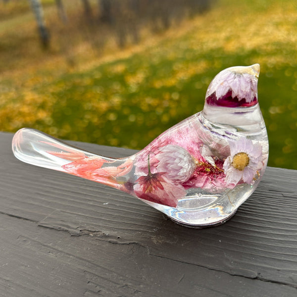 Cherry blossom resin bird with a round piece of dark pink glass in the head