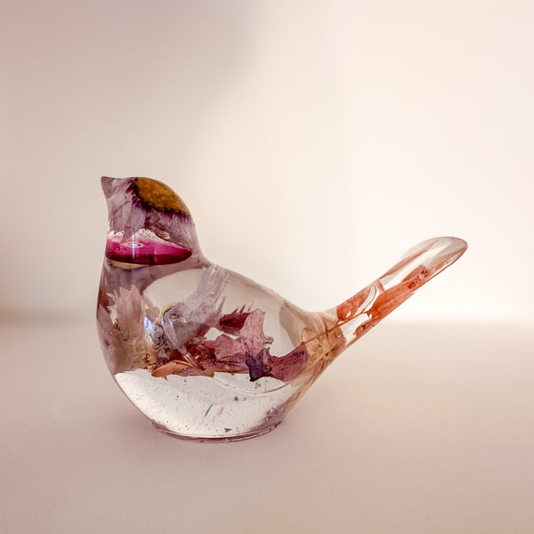 Close up of the dried blossoms inside a cherry blossom resin bird