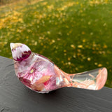 Cherry blossom resin bird with daylight passing through the pink petals