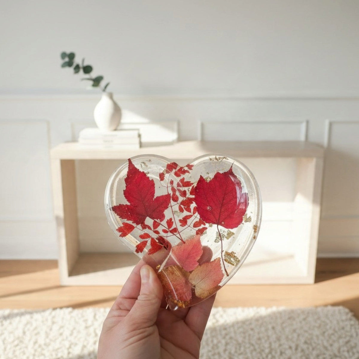 Red maple leaf resin tray in a clear heart shape, with crimson and blush foliage and scattered gold leaf.