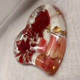 Red maple leaf resin tray with crimson and blush foliage, clear glossy finish, gold leaf flakes and heart shape.