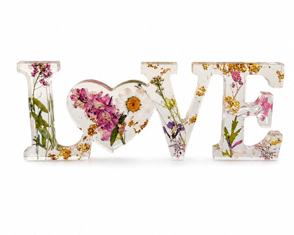 Daisy resin word art with real pressed white daisy in heart-shaped O, blush blooms, and gold leaf flakes