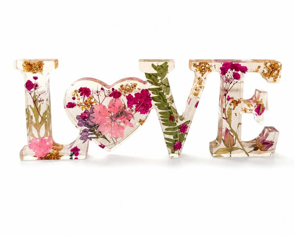 Fuchsia Garden LOVE resin word art with pressed pink and fuchsia flowers, fern fronds, and gold leaf flakes