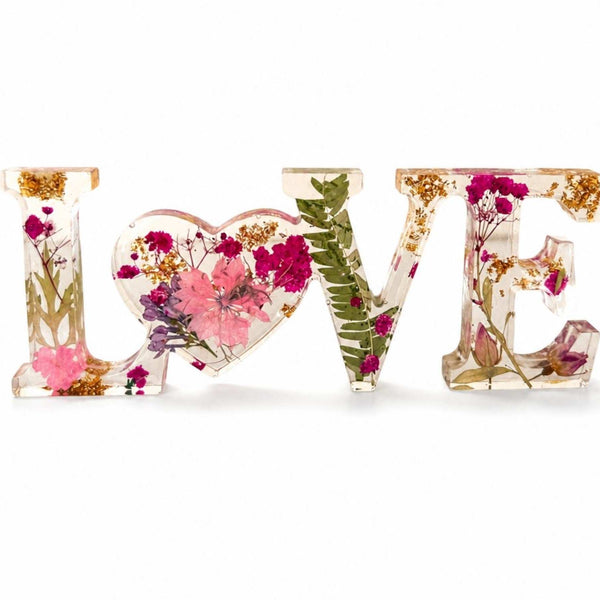 Fuchsia Garden LOVE resin word art with pressed pink and fuchsia flowers, fern fronds, and gold leaf flakes