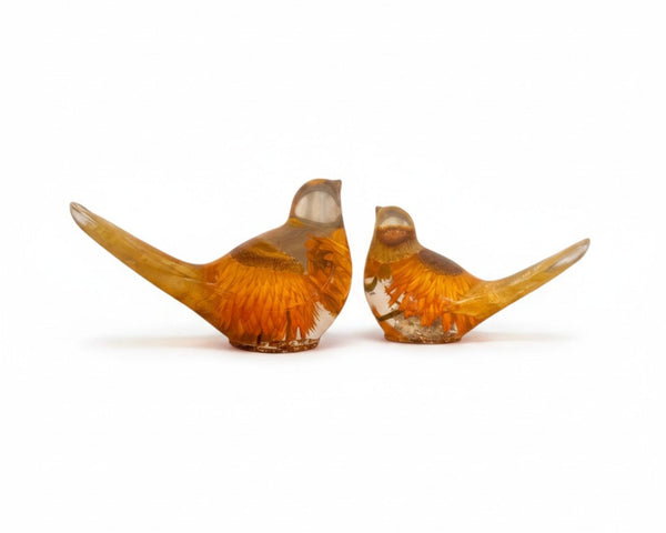 Strawflower resin bird pair with preserved yellow and amber flowers encased in clear resin sculptures