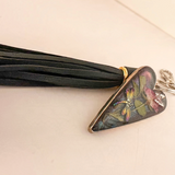 dragonfly resin keychain with a bronze-edged heart, colourful dragonfly, pressed rose and leaves, and black tassel