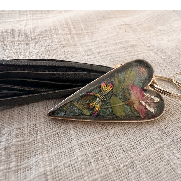 dragonfly resin keychain with a smoky green heart-shaped resin pendant, pressed pink rose, colorful dragonfly and black tassel