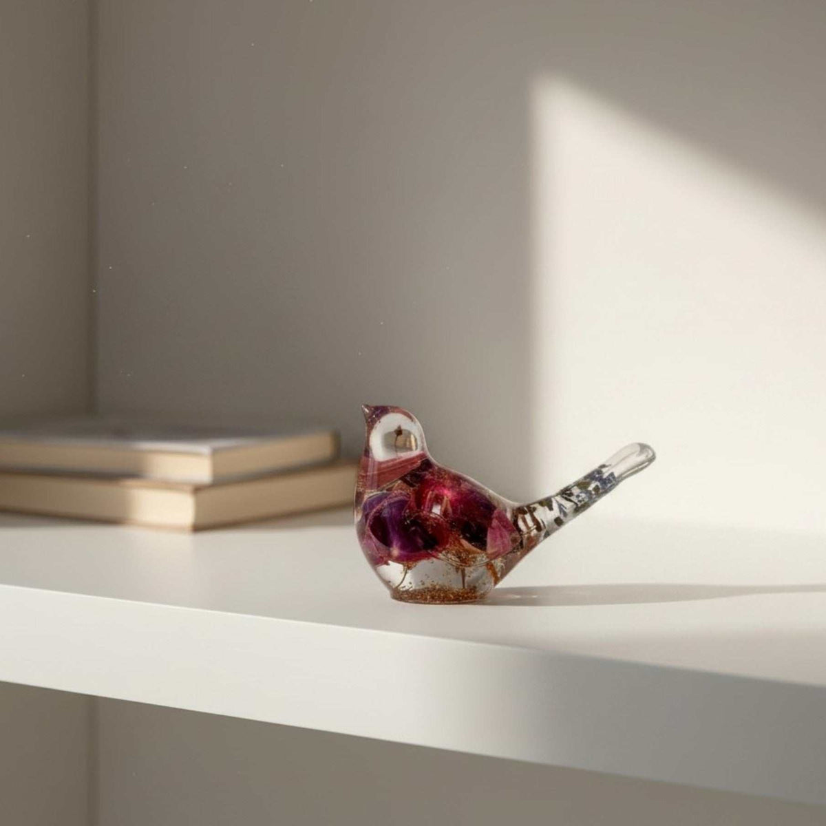 Handmade clear resin bird with real preserved fuchsia flowers and gold leaf accents