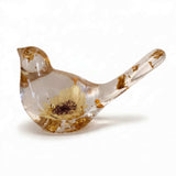 Gold leaf resin bird with a single creamy yellow sunflower set in clear resin