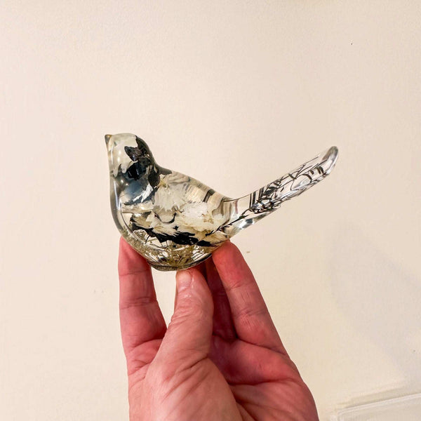 Handmade chickadee bird figurine with black blooms at the cap and bib