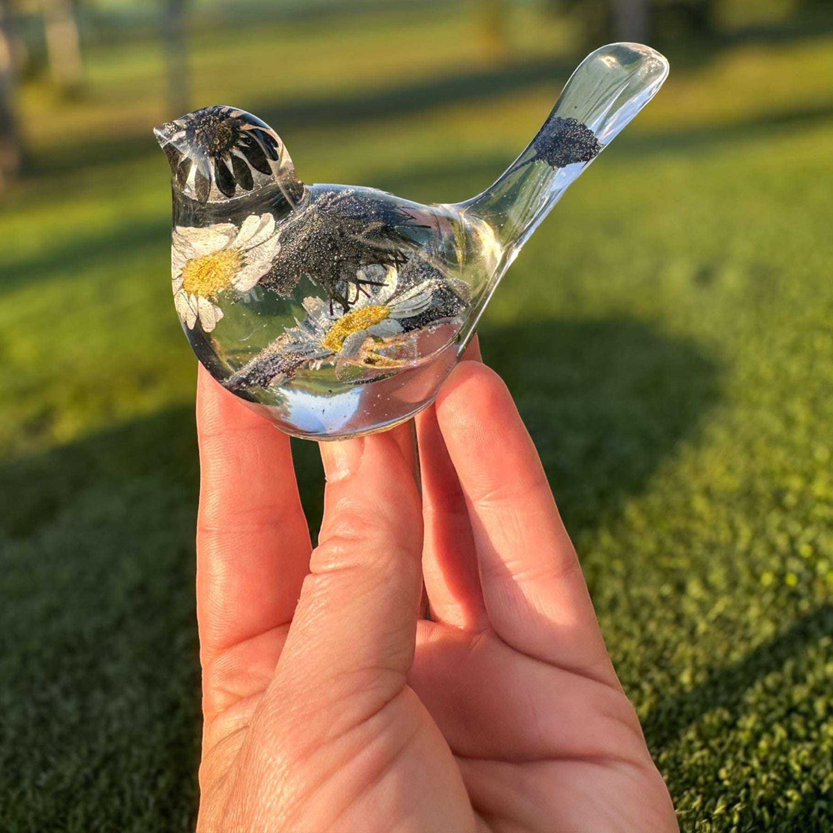 Black and white handmade chickadee resin songbird on a windowsill