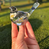 Black and white handmade chickadee resin songbird on a windowsill
