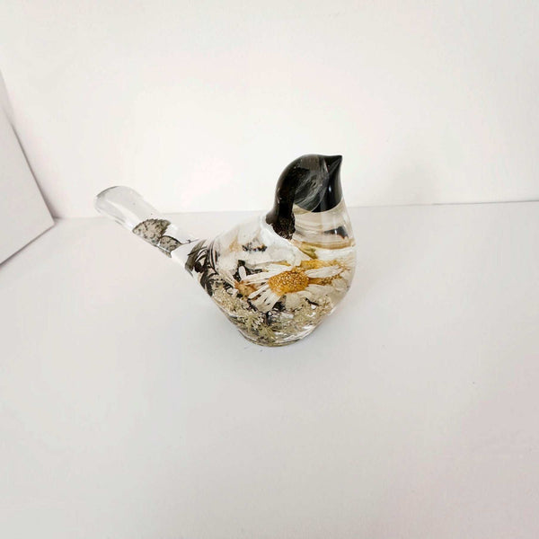Handmade chickadee resin bird showing flower placement across the back