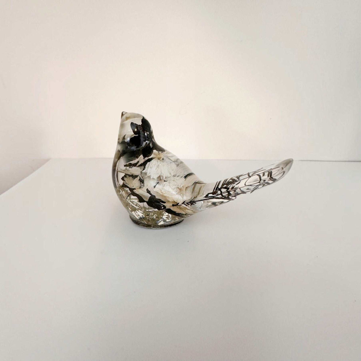 Handmade chickadee bird decor measuring 4 inches long and 2.5 inches high