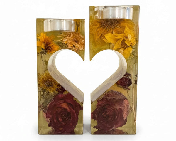heart tealight holder set of two clear resin pieces with yellow dried flowers, deep red roses, and a heart-shaped center
