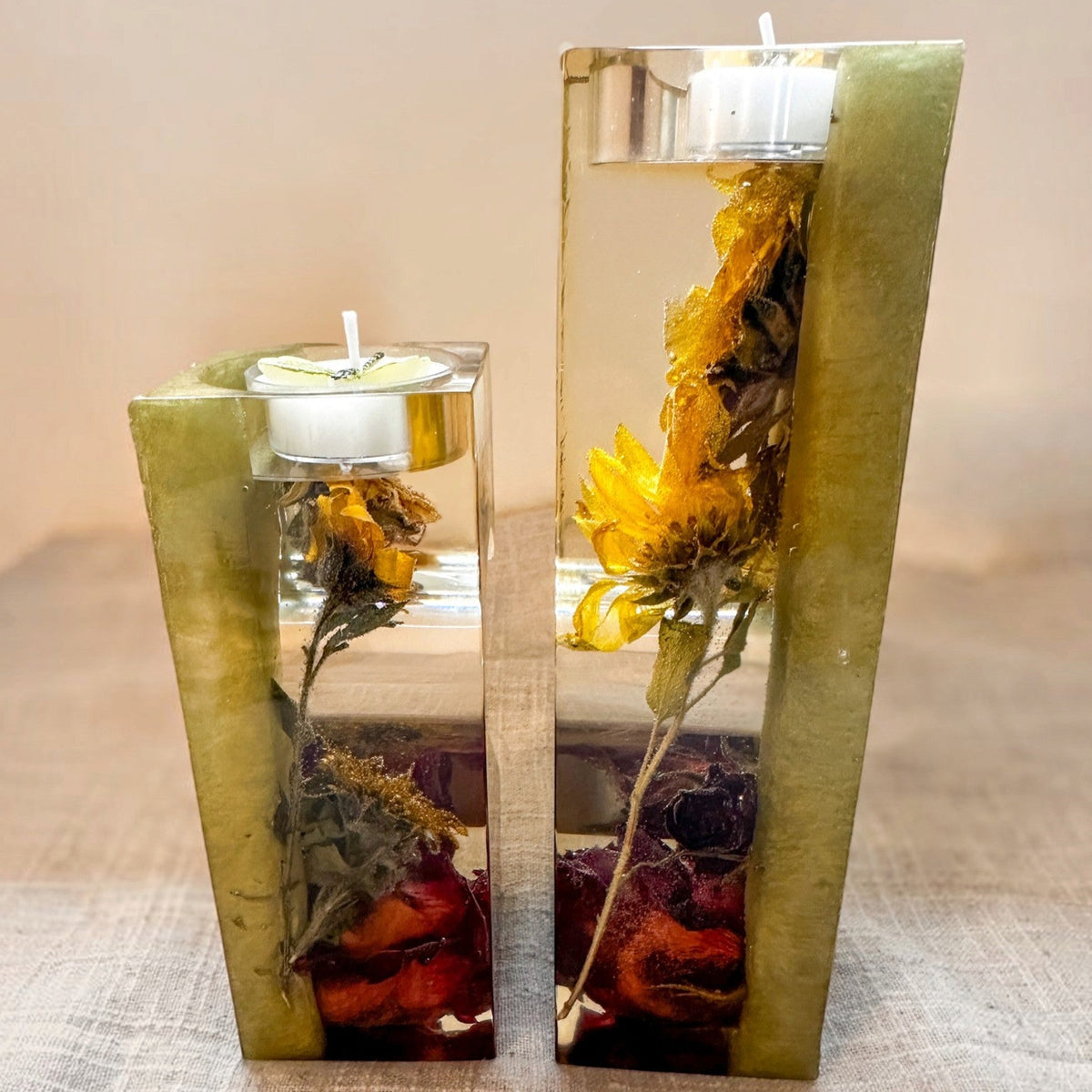 Heart tealight holder set of two clear resin pieces with sage green backs, dried yellow sunflowers and deep red roses