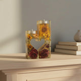 Heart tealight holder set in clear resin, with yellow sunflowers and deep red roses forming two halves of a heart